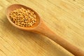 Wood spoon and roasted sesame seeds