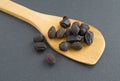 Wood spoon filed with saw palmetto berries Royalty Free Stock Photo