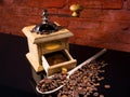 Wood Spoon, Roasted Coffee Beans and Grinder Royalty Free Stock Photo