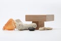 Wood stack cube platform podium and stones, shell on gray light copy spase background. Minimal empty display product presentation