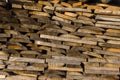 Wood stack of neatly stacked firewood and boards for drying fire Royalty Free Stock Photo