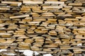 Wood stack of neatly stacked firewood and small wood to dry for