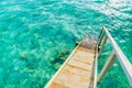 Wood stair into the sea of tropical Maldives island . Royalty Free Stock Photo