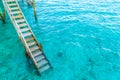 Wood stair into the sea of tropical Maldives island . Royalty Free Stock Photo