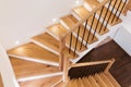 Wood staircase inside contemporary white modern house. Royalty Free Stock Photo