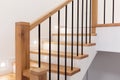 Wood staircase inside contemporary white modern house. Royalty Free Stock Photo