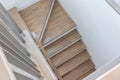 Wood staircase inside contemporary white modern house Royalty Free Stock Photo