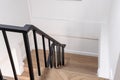 Wood staircase inside contemporary white modern house