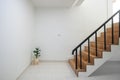 Wood staircase inside contemporary white modern house