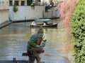 Wood statue of a gnome on a Kampa canal in Prague in Czech Republic.