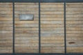 Wood and steel slide door with label of house number