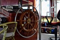 Wood steering wheel of a cruise ship. Close-up Royalty Free Stock Photo