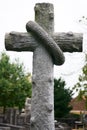 Wood stone cross on a grave. Historic graveyard.