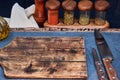 Wood and stone on table with spices and knives