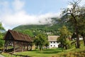 Wood Storage Building & Farm House Royalty Free Stock Photo