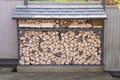 Wood store full of seasoned logs for woodburner