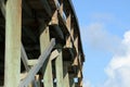 The wood structure of a fishing pier allows for movement as the wood beams expand and contract