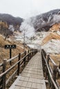 Wood structure walk way of Noboribetsu Jigokudani Hell Valley: The volcano valley got its name from the sulfuric smell. Royalty Free Stock Photo