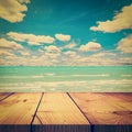 Wood table and beach sand sea with blue sky clouds Royalty Free Stock Photo