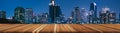 Wood table with blurred background of cityscape at night lights scene urban view,web banner header panoramic,copy space,empty Royalty Free Stock Photo