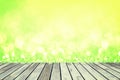 Wood table and bokeh abstract nature green background