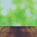 Wood table and bokeh abstract nature green background Royalty Free Stock Photo