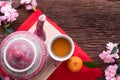 Wood table with cup of tea and Cherry blossom, Chinese new year celebration background Royalty Free Stock Photo