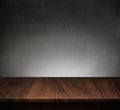 Wood table with dark concrete texture background