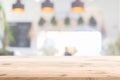 Wood table foreground with blur home cafe kitchen background