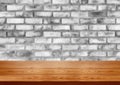 Wood table in front of brick wall blur background. Royalty Free Stock Photo