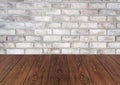 Wood table in front of brick wall blur background. Royalty Free Stock Photo