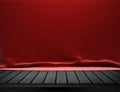 Wood table with red velvet cloth background