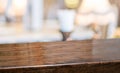 Wood table at restaurant blur background.Empty perspective hardwood bar with blur coffee shop with bokeh light,Mock up for display Royalty Free Stock Photo