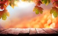 A wood table, tabletop product display with a golden autumn sunset sky and leaves background Royalty Free Stock Photo