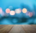 Wood table top on abstract background with bokeh defocused lights