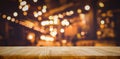 Wood table top Bar with blur light bokeh in dark night cafe Royalty Free Stock Photo