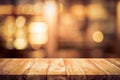 Wood table top Bar with blur light bokeh in dark night cafe,restaurant background Royalty Free Stock Photo