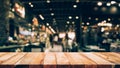 Wood table top Bar with blur light bokeh in dark night cafe,restaurant background Royalty Free Stock Photo