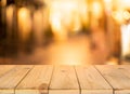 Wood table top Bar with blur light bokeh in dark night cafe,restaurant background Royalty Free Stock Photo