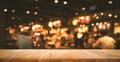 Wood table top Bar with blur light bokeh in dark night cafe