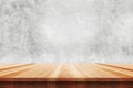 Wood table top on bare concrete wall background - can be used for display or montage your products Royalty Free Stock Photo