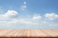 Wood table top on blue sky with clouds background Royalty Free Stock Photo