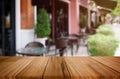 Wood table top on blur background of coffee shop (or restaurant) interior - can be used for display or montage your products Royalty Free Stock Photo