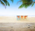 Wood table top on blur beach background with beach chairs Royalty Free Stock Photo