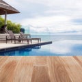 Wood table top on blur Beach chair in outdoor with swimming pool Royalty Free Stock Photo