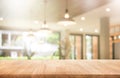 Wood table top with blur coffee shop or cafe,restaurant