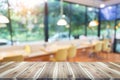 Wood table top with blur in coffee shop or cafe,restaurant background Royalty Free Stock Photo