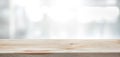 Wood table top on blur glass window wall building background. Royalty Free Stock Photo