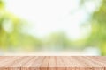 Wood table top on blur green abstract background from nature Royalty Free Stock Photo