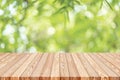 Wood table top on blur green abstract background from nature Royalty Free Stock Photo